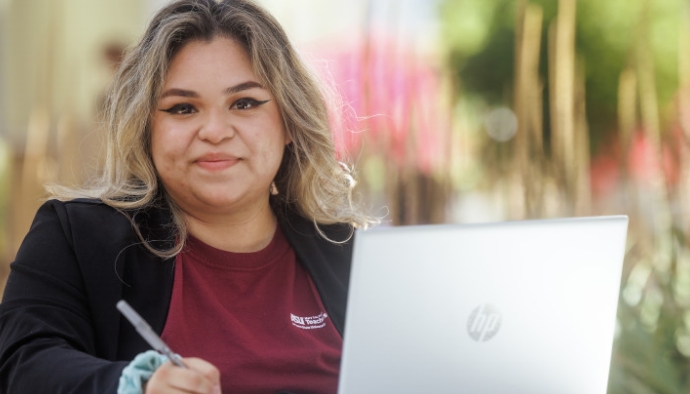 Rachel Carranza, a student majoring in theatre (acting) with a certificate in secondary education from Phoenix, AZ studies solo outside of the MU on Tempe campus on April 18, 2022.